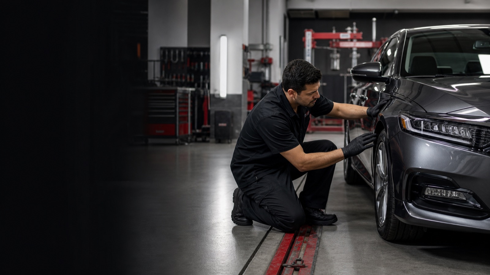 Technician completing a collision repair quality inspection